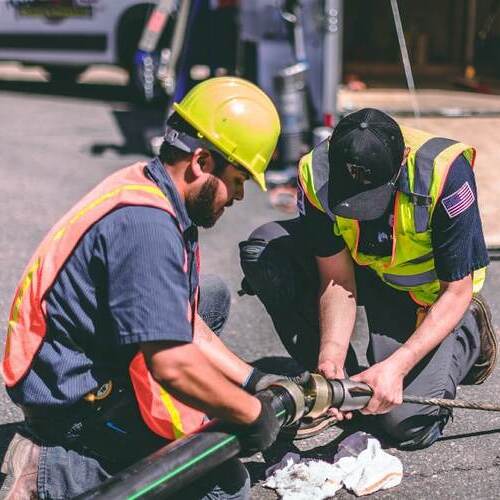 workers providing plumbing services