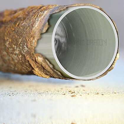 close-up of a pipe with corroded lining