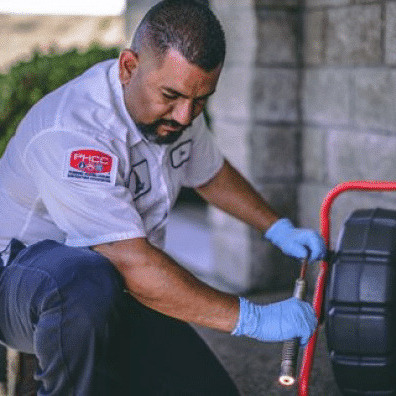 worker providing a plumbing inspection